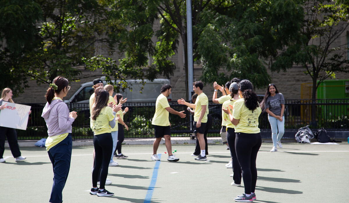 Photo, incoming class participating in the bellringer games.